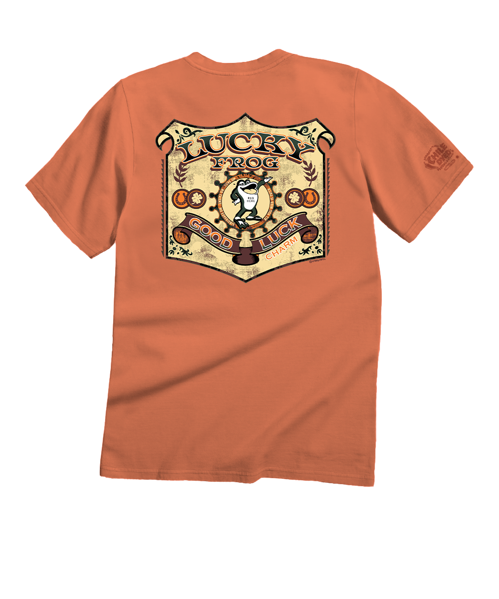 An orange short-sleeve t-shirt shown from the back, featuring a large vintage-style 'Lucky Frog' shield graphic in beige, brown, and black on the back, with a smaller matching graphic on the left sleeve. View 1