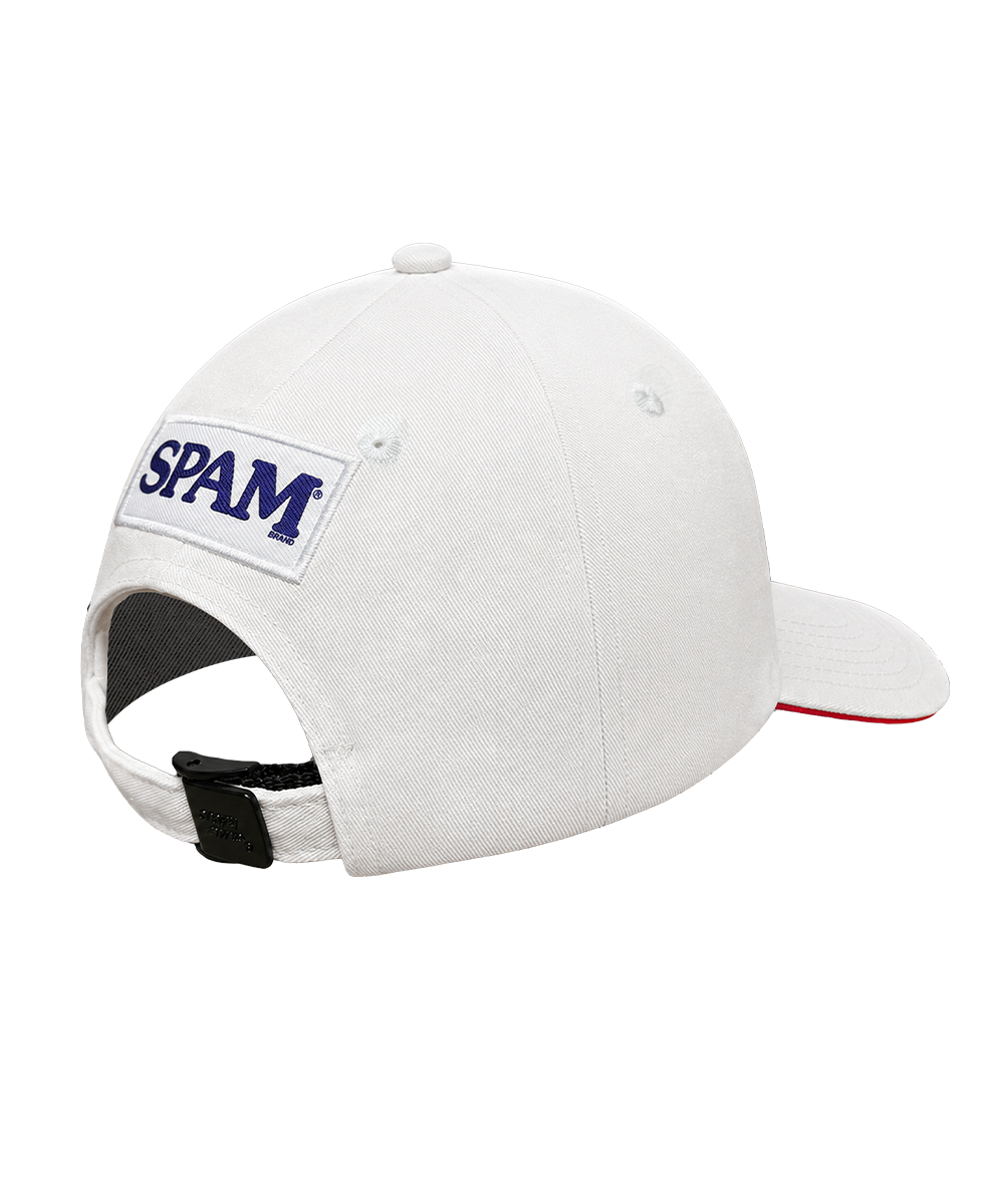 White baseball cap with a white rectangular patch on the back featuring the word 'SPAM' in navy blue, shown on a plain white background. View 2