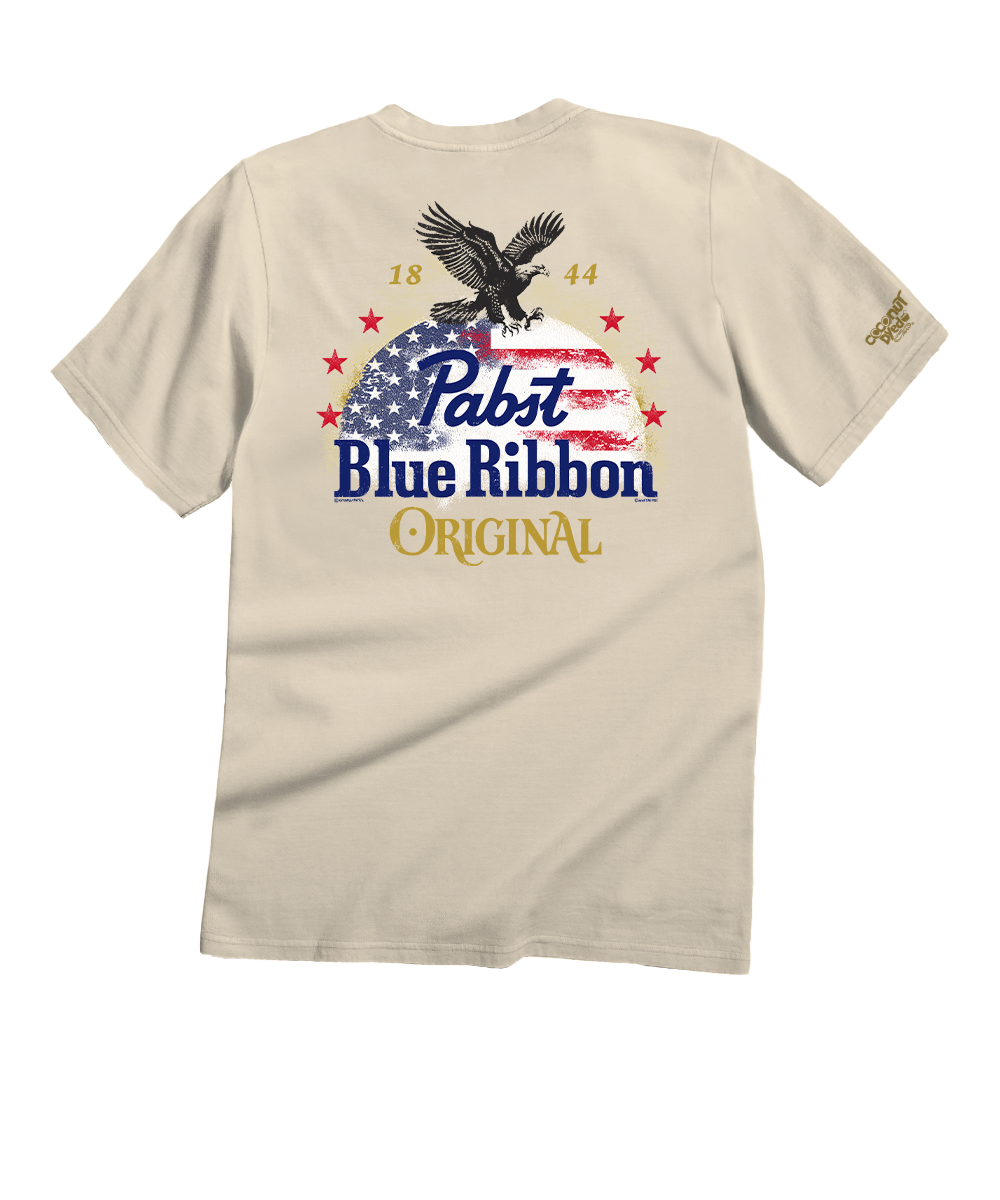 Beige t-shirt with Pabst Blue Ribbon logo featuring an eagle and American flag design on a white background. View 1