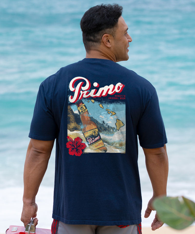 Man wearing a navy blue t-shirt with 'Primo' branding on the beach View 2