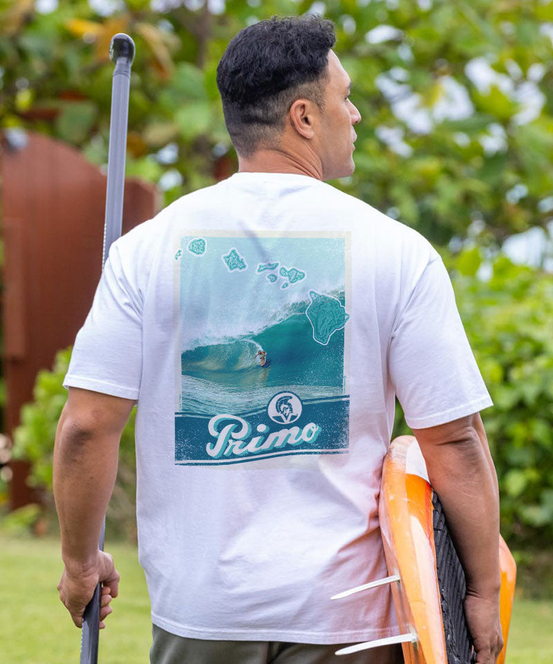 Man wearing a white t-shirt with a graphic design and 'Primo' branding, holding a paddle and surfboard. View 2