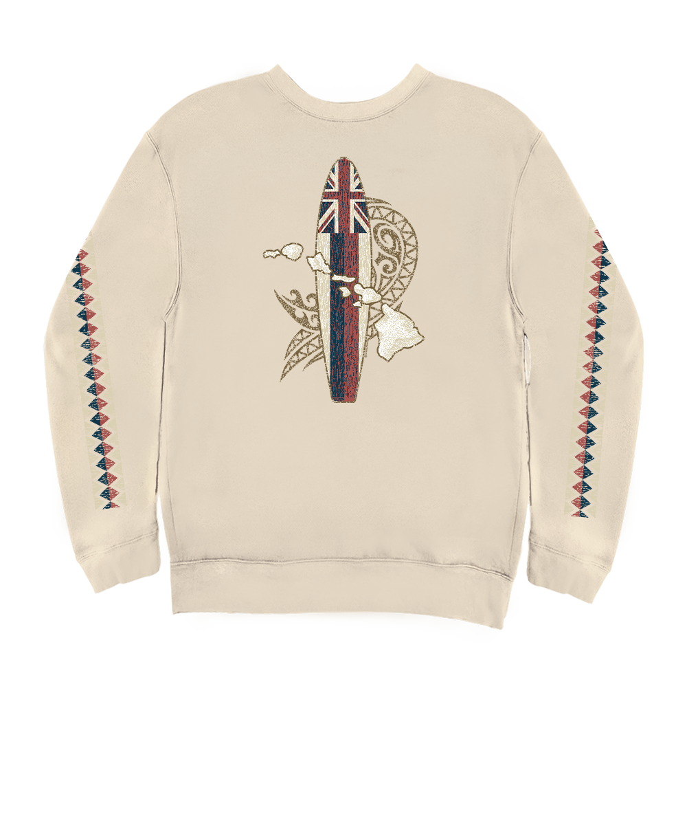 A cream-colored crewneck sweatshirt featuring a central graphic of a Polynesian-style surfboard with a Union Jack flag on top, surrounded by tribal patterns and a hula hand gesture. The sleeves are decorated with vertical geometric patterns in red, blue, and cream. View 1