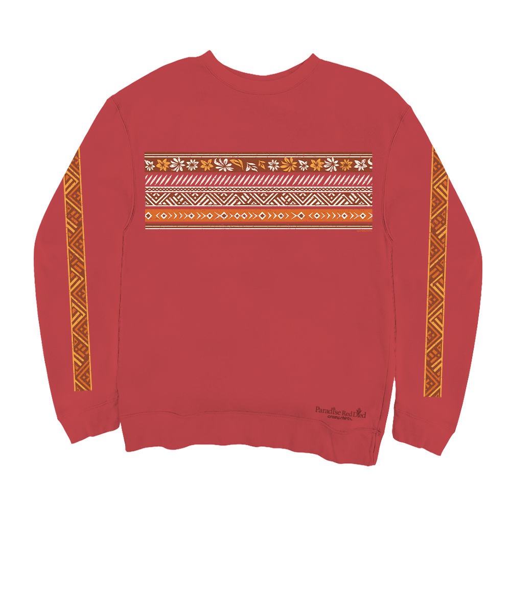 A red crewneck sweatshirt featuring a horizontal band of geometric and floral patterns across the chest, with matching vertical patterned stripes down both sleeves. View 1