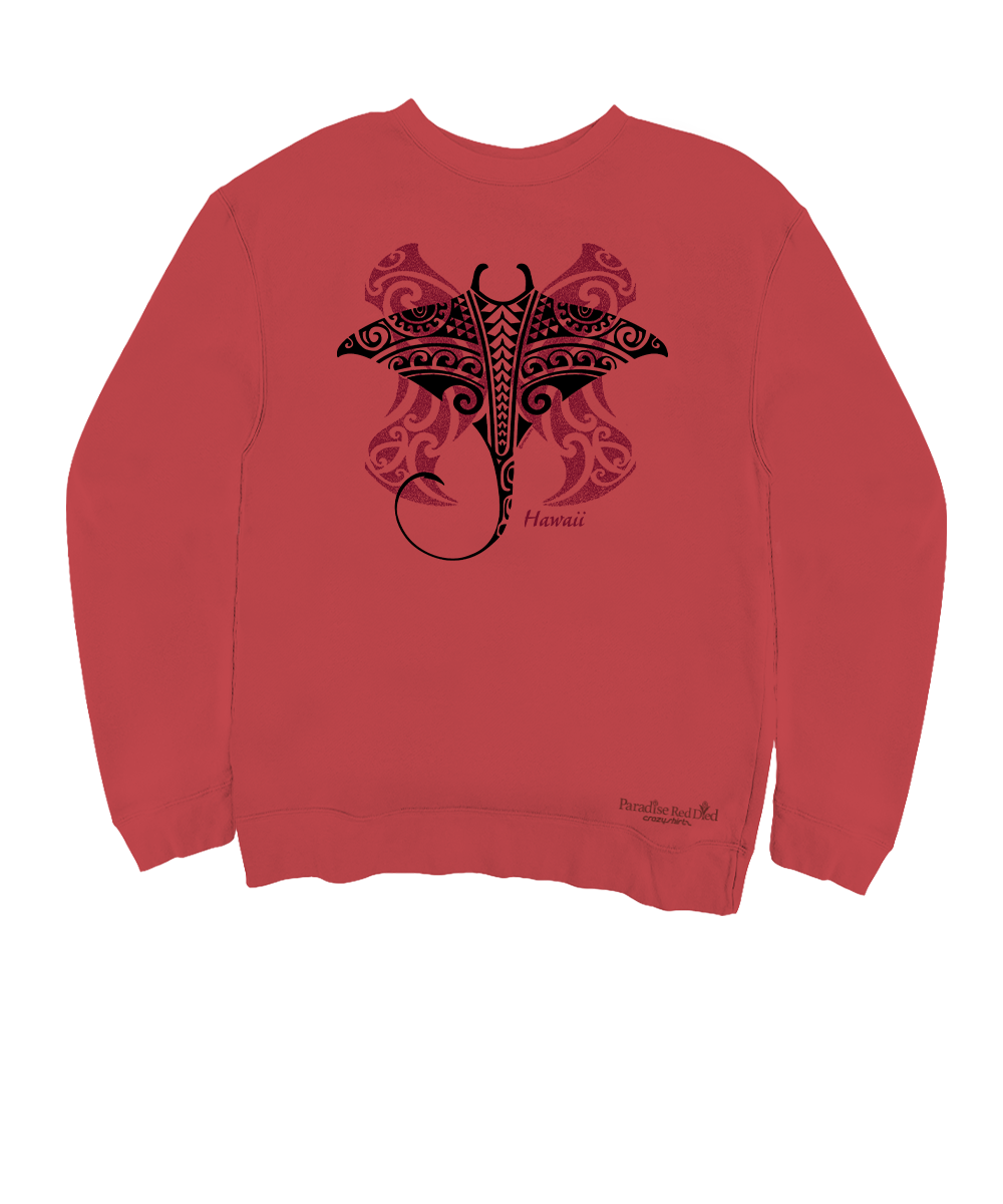A coral red crewneck sweatshirt featuring a black and dark red Polynesian-style manta ray graphic on the chest, with a small brand logo near the bottom right hem. View 1