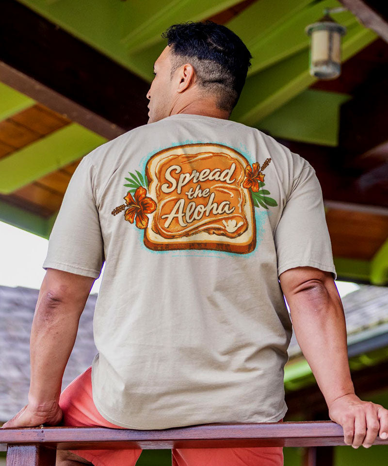 Man wearing a t-shirt with 'Spread the Aloha' design outdoors. View 2