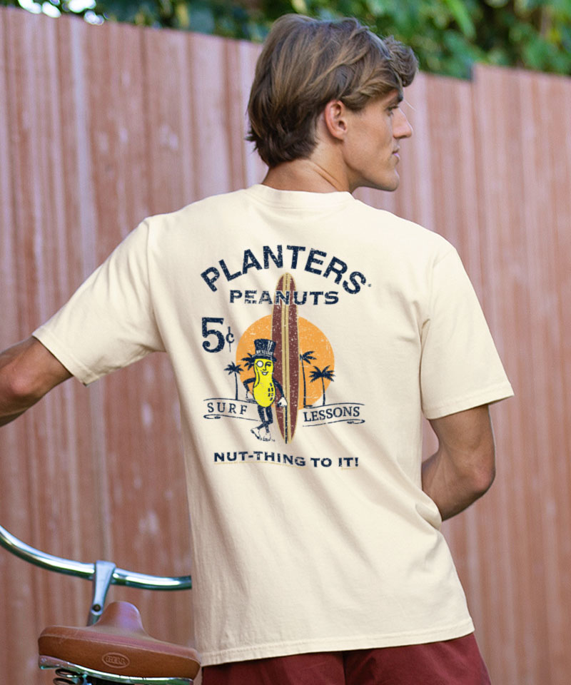 Person wearing a t-shirt with a vintage Planters Peanuts advertisement design. View 2