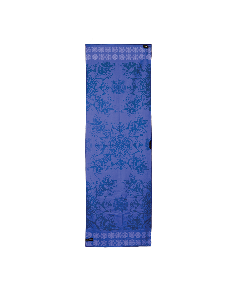 A vertical rectangular scarf in shades of blue and purple, featuring a detailed floral mandala pattern and a geometric pattern border at the top and bottom, shown against a plain white background. View 2