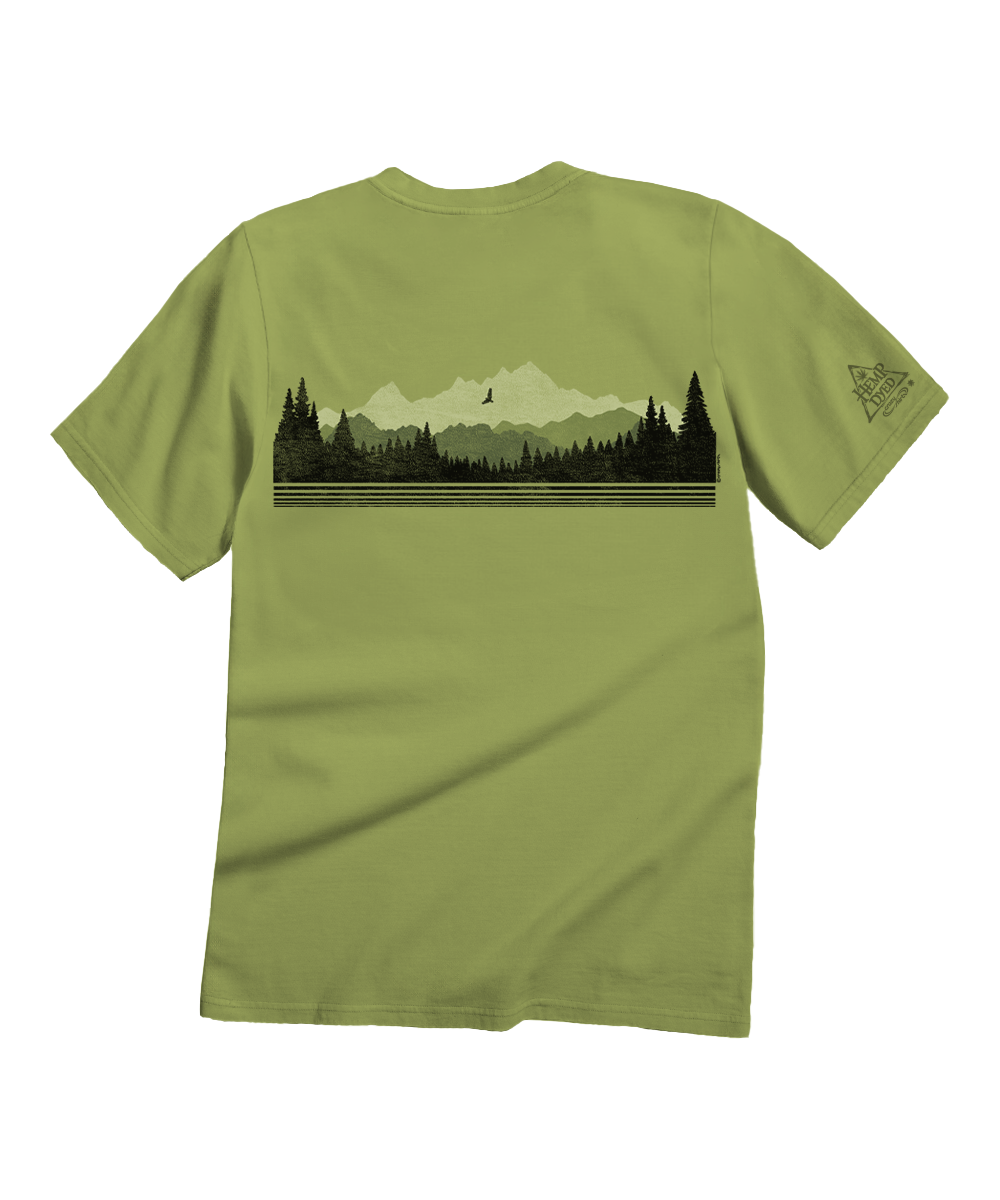An olive green short-sleeve t-shirt shown from the back, featuring a horizontal graphic print of a mountain range, pine forest, and a bird silhouette. A small geometric logo is printed on the left sleeve. View 4
