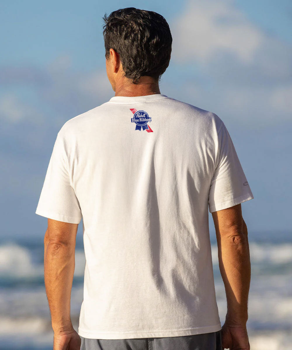 Man wearing a white t-shirt with a logo on the beach View 3