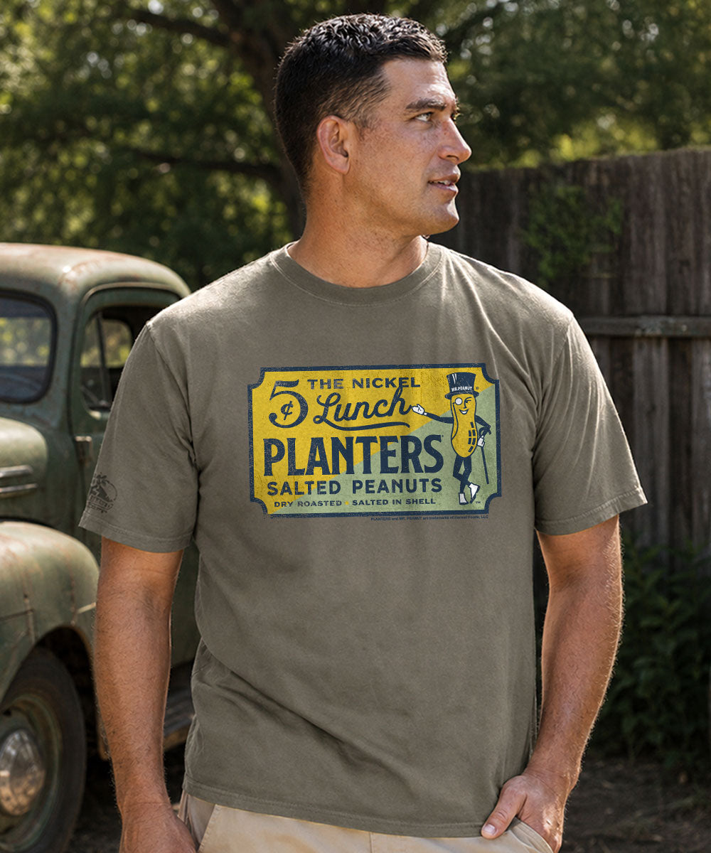 Man wearing a gray t-shirt with a vintage Planters Peanuts logo. View 2