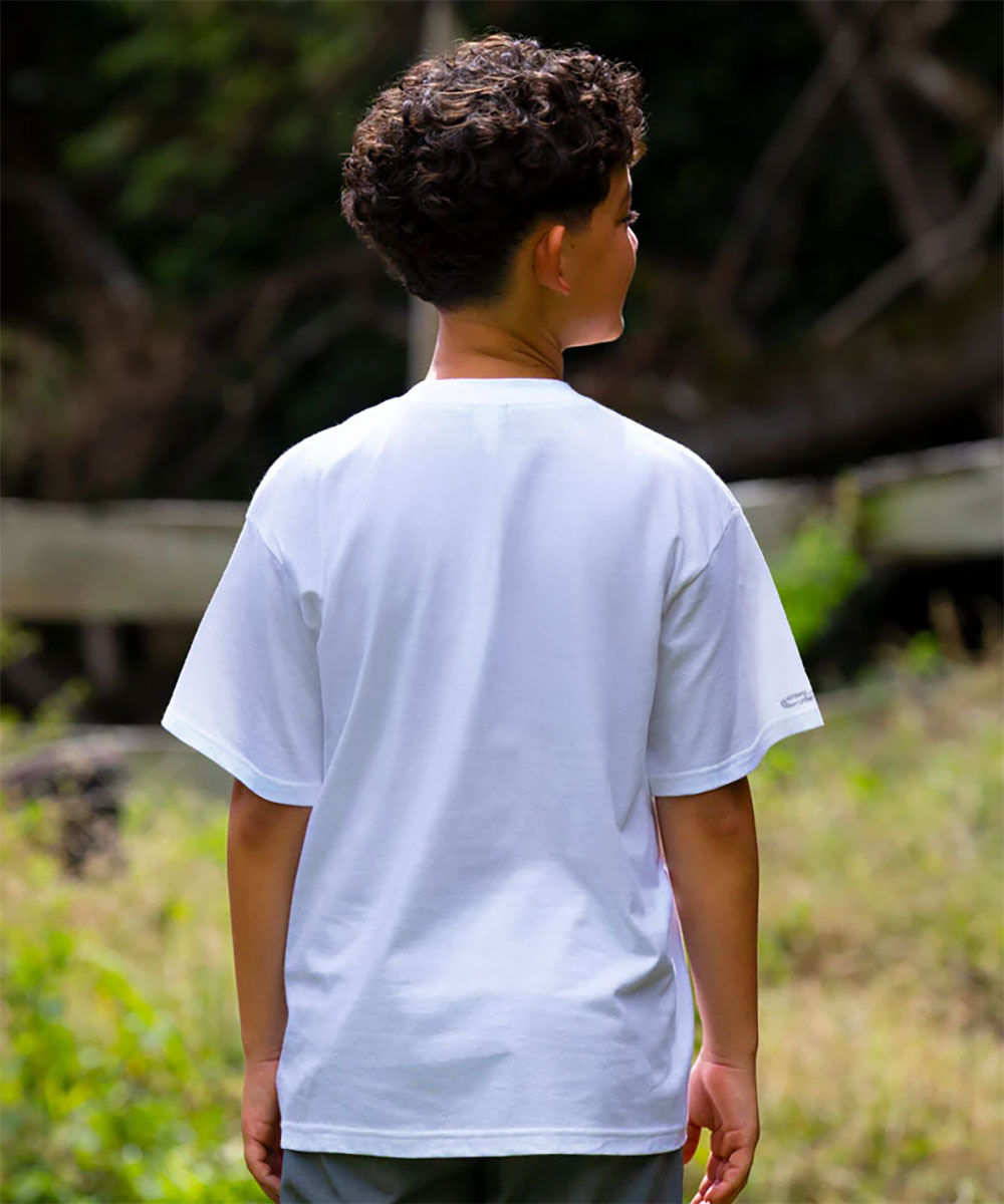 Person wearing a white t-shirt standing outdoors with a natural background View 3