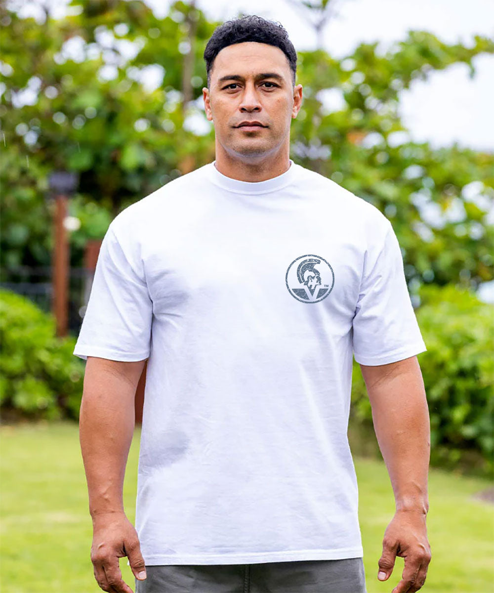 Man wearing a white t-shirt with a logo outdoors View 3