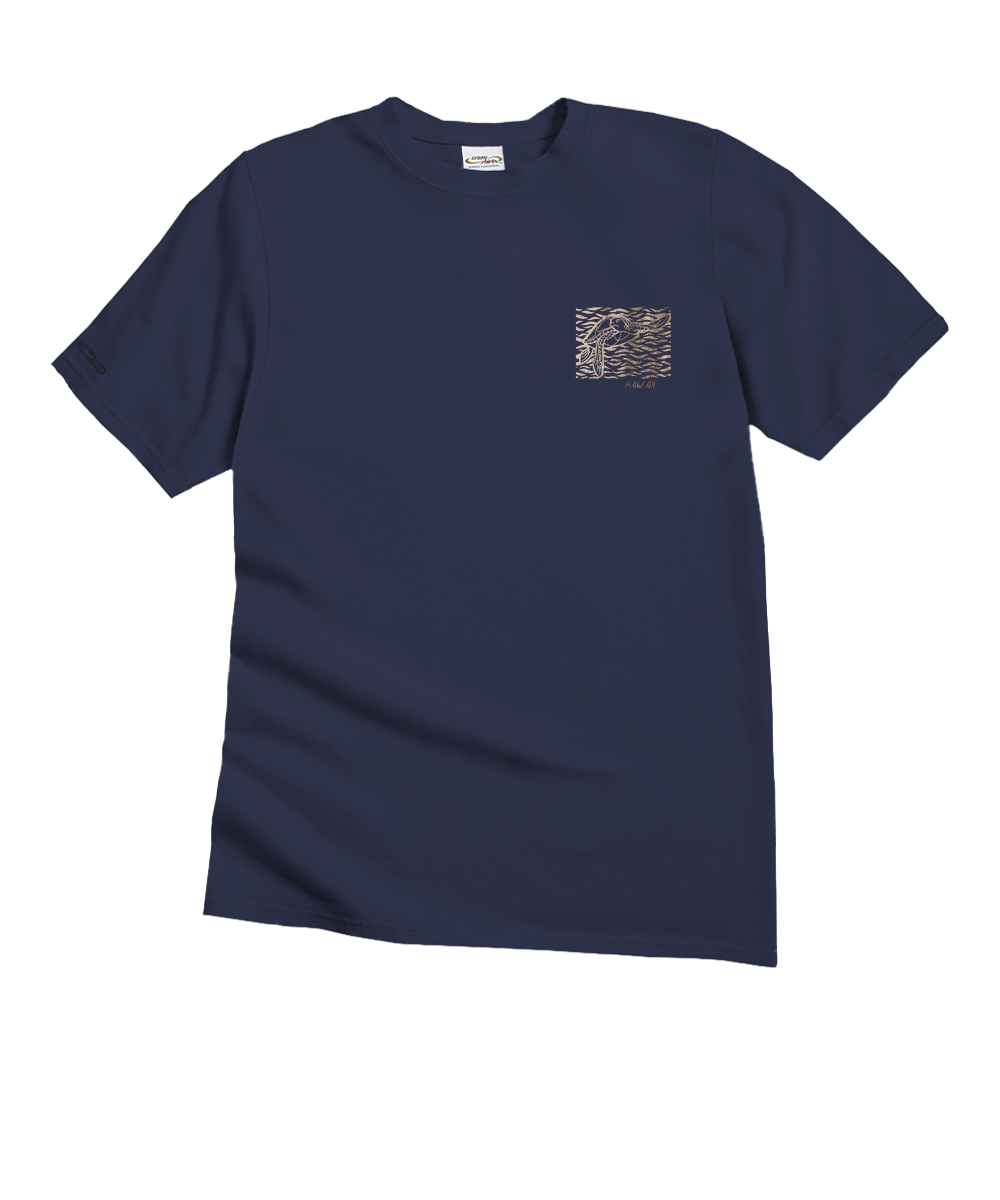 A navy blue short-sleeve crewneck t-shirt with a small square chest graphic on the left side, featuring a pattern of brown, beige, and gray shapes making a turtle. The shirt is displayed flat against a solid white background. View 4