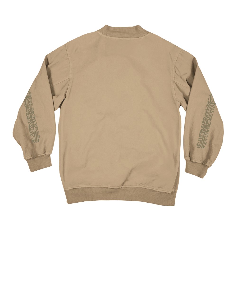 A tan crewneck sweatshirt shown from the back, featuring dark gray tribal-style graphic prints down both sleeves, set against a plain white background. View 4