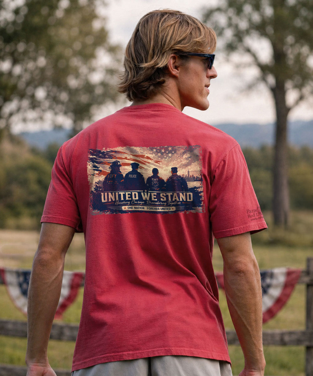A man wearing a red t-shirt with a large back graphic that reads 'UNITED WE STAND' and '2024 National Anthem', photographed outdoors View 2