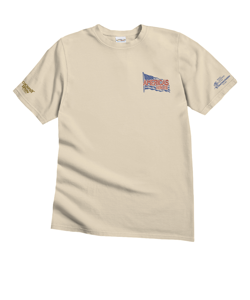 A beige short-sleeve crewneck t-shirt with a small graphic on the left chest featuring a waving American flag with the text 'AMERICANS TRUST'. The right sleeve has a gold-colored graphic, and the left sleeve has a blue graphic. View 4