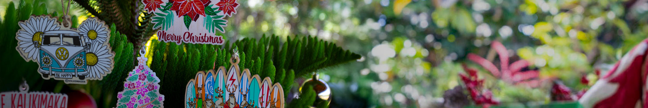 Decorative Christmas ornament with festive designs on a blurred natural background