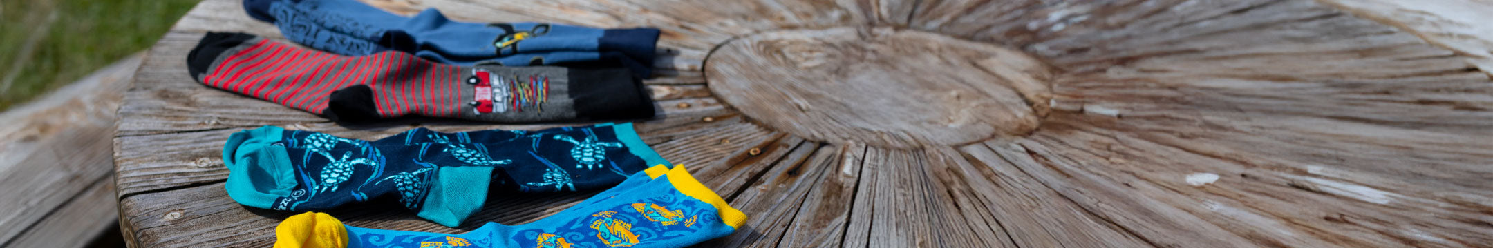 Colorful socks on a wooden surface