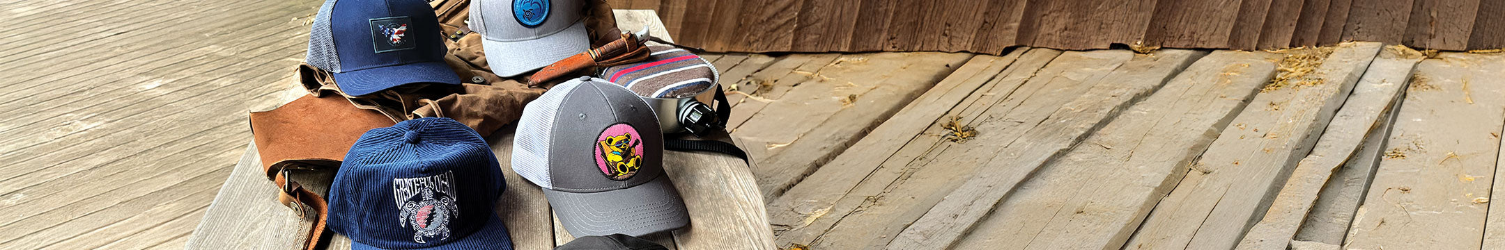 Collection of Crazy Shirt Hats on a wooden surface