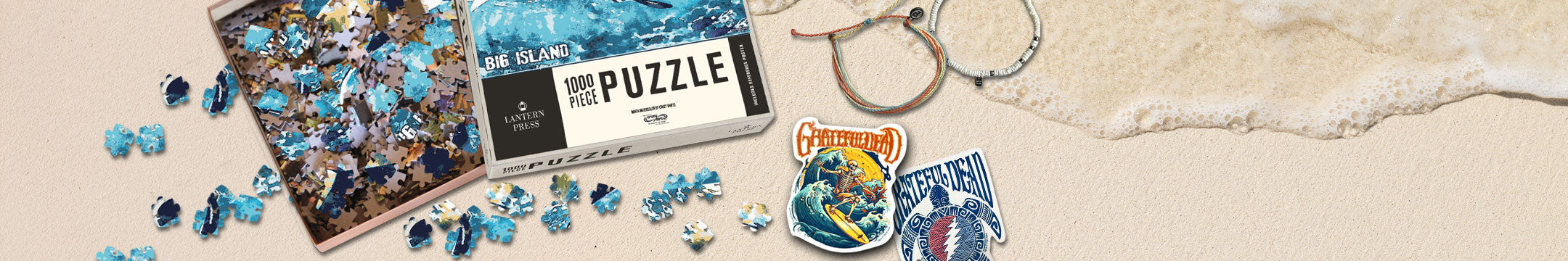 Jigsaw puzzle with blue pieces and packaging on a sandy background