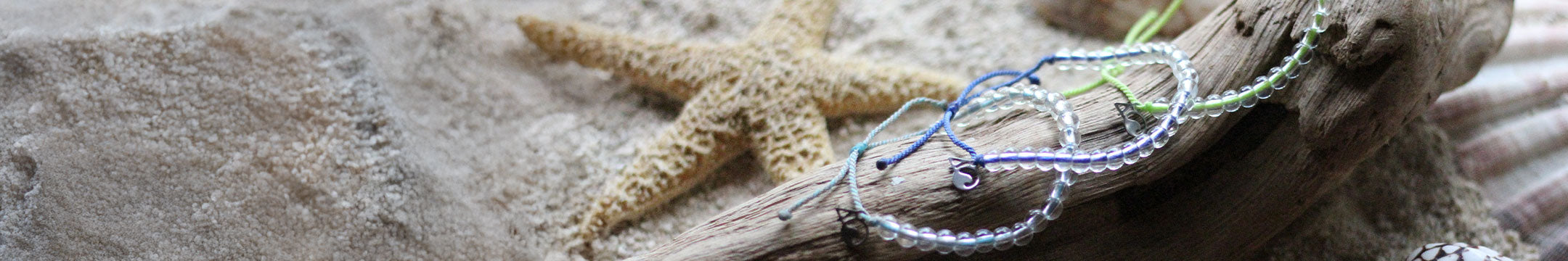 4Ocean bracelet on a stone surface with a starfish