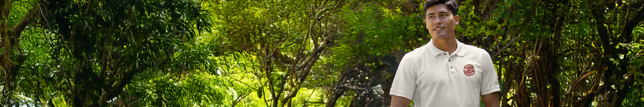Man standing in a lush green forest