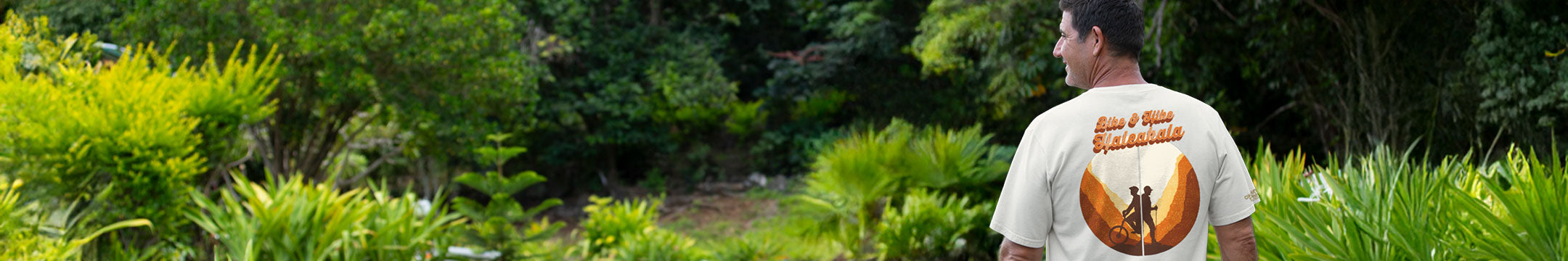 Man wearing a t-shirt with a graphic design in a garden setting