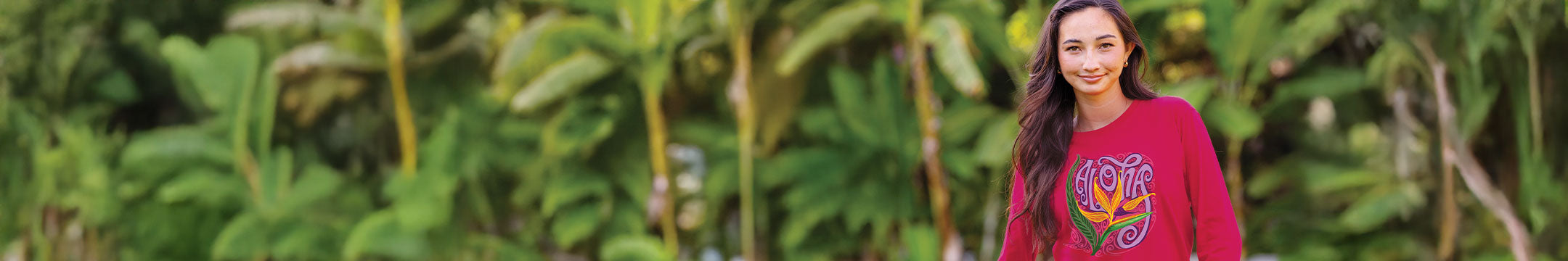 Woman wearing a colorful shirt with a nature background
