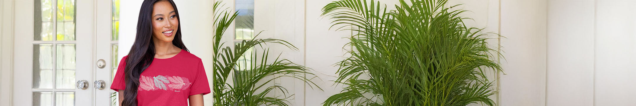 Woman standing in a vehicle with a scenic background wearing a crazy shirt