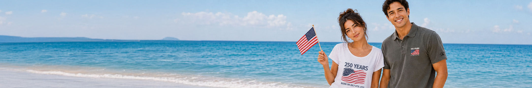 Two people standing on a beach with a clear blue sky and ocean.