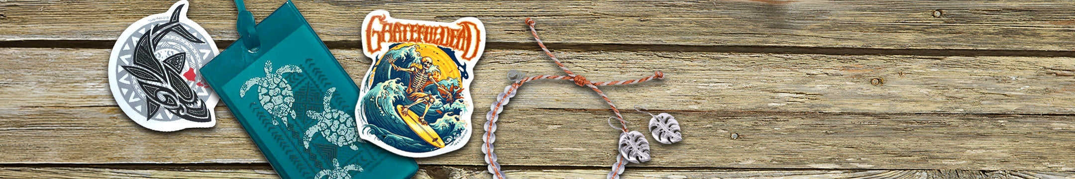 A collection of accessories and trinkets featuring stickers, luggage tags, a bracelet and earrings. 
