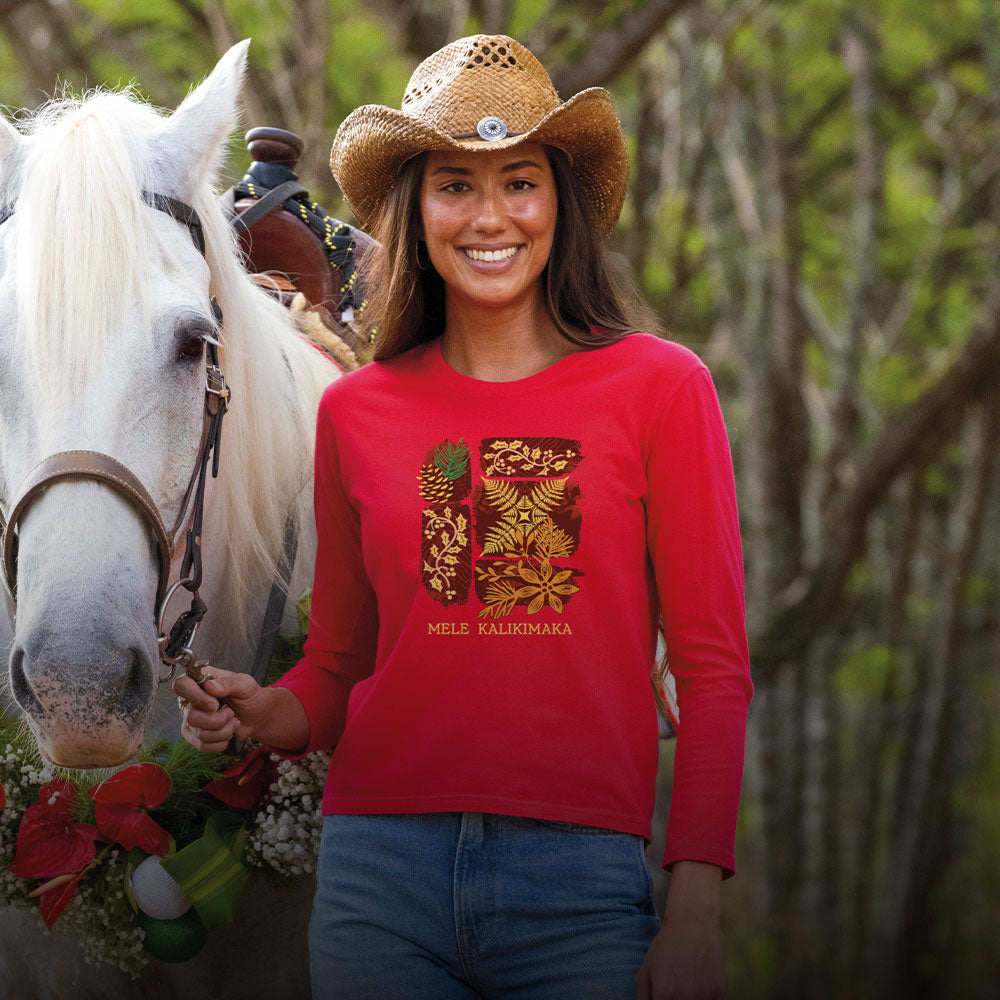 Woman in a red shirt and cowboy hat standing next to a white horse with a blurred background